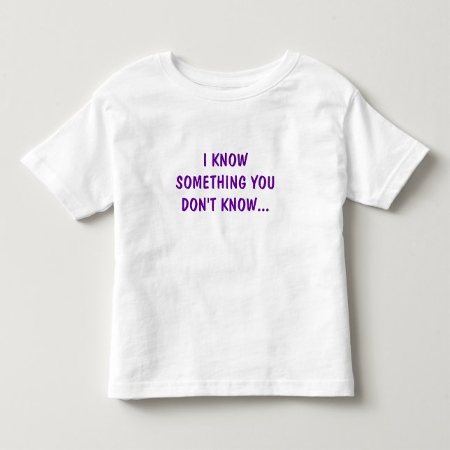 CAMISETA INFANTIL EU SEI DE ALGO QUE VOCÊ NÃO SABE... (Frente)