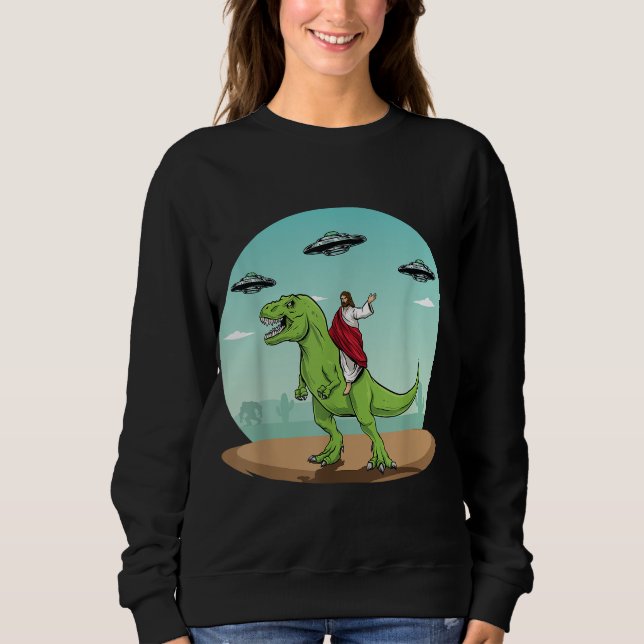 Camiseta Jesus Dirigindo Um Dinossauro Engraçado OVNI Alien (Frente)