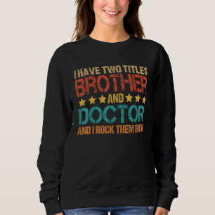 Camiseta Médico Tenho Dois Títulos Irmão e Doutor Bro
