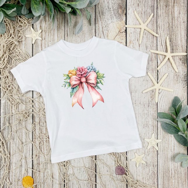 Camiseta Meninas Coquette com Florais de Arco Rosa em Aquar (Pink bow with watercolor florals, coquette aesthetic, Toddler Girls T-shirt)