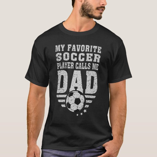 Camiseta Mens Meu Jogador De Futebol Favorito Me Chama Pai  (Frente)