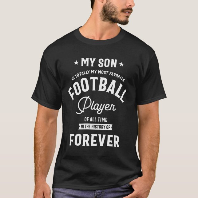 Camiseta Meu filho é totalmente meu jogador de futebol mais (Frente)