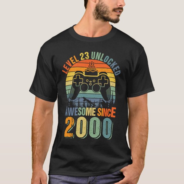 Camiseta Nível 23 Desbloqueado 23º Aniversário Gamer 2000 B (Frente)