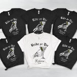 Camiseta Noiva Ou Morre Até Morte Fizermos Bachelorette<br><div class="desc">Aproveite o lado negro e lúdico das suas festividades de solteira com a nossa Camisa de Três Blend "Noiva ou Morte até a Morte do Nós Partimos". Perfeito para uma festa de solteira com tema gótico ou Halloween, esta camisa apresenta um design ousado e humorístico que adiciona um toque de...</div>