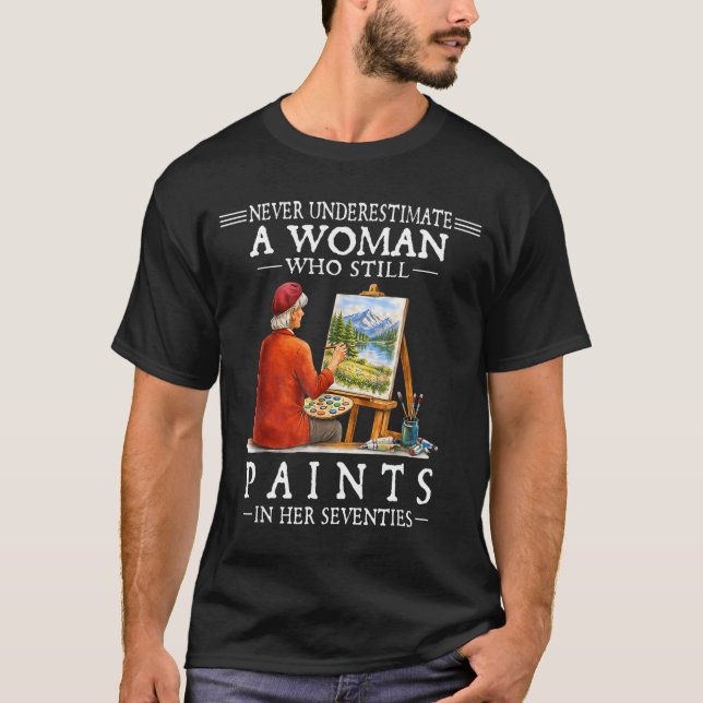 Camiseta Nunca subestime uma mulher que ainda pinta  (Frente)