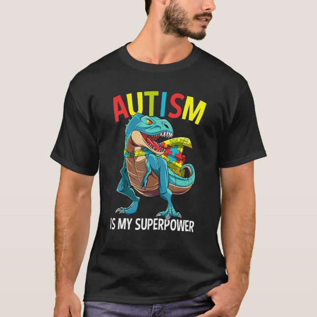 Camiseta O Autismo É Meu Superpoder Dinosaur Puzzle Piece (Frente)