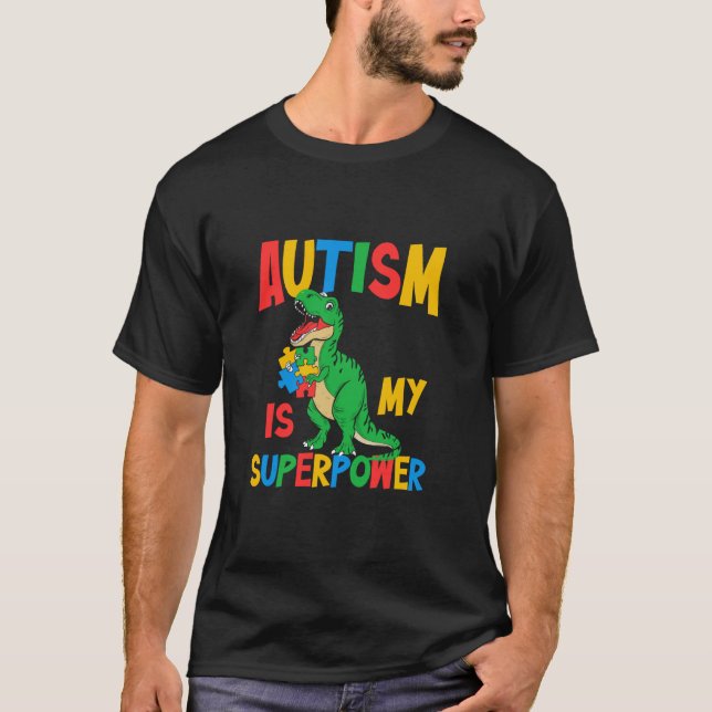 Camiseta O Autismo É Meu Superpoder T-rex Puzzle Conscienti (Frente)