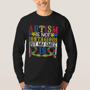 Camiseta O autismo não é contagiante, mas meu sorriso é ins