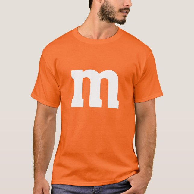 Camiseta O Carnaval do M & M Disfarça o Dia das Bruxas (Frente)