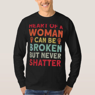 Camiseta O Coração De Uma Mulher Pode Ser Quebrado, Mas Nun