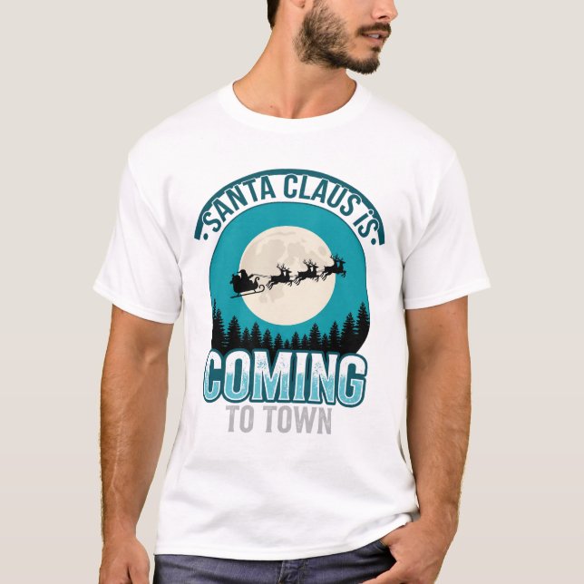 Camiseta O Papai Noel Vem Para a Cidade Projeto da Lua de N (Frente)