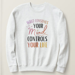 Camiseta O que consome sua mente cite o pensamento positivo