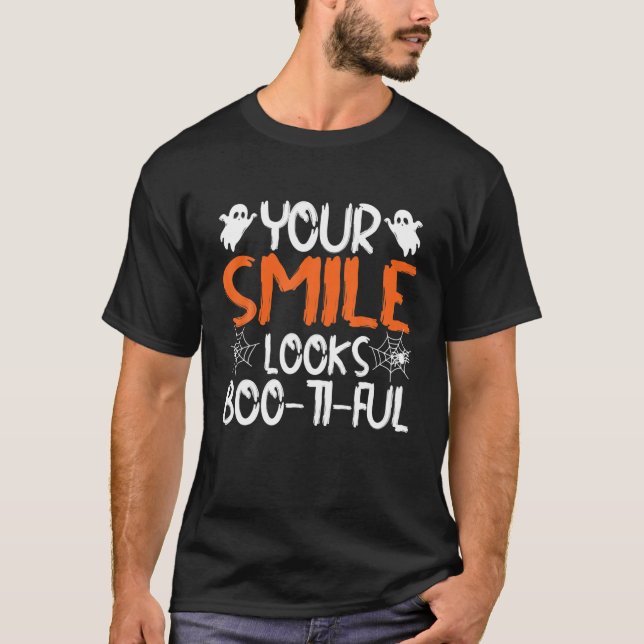 Camiseta O Seu Sorriso Parece Um Hallowee De Dentista Engra (Frente)