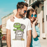 Camiseta Oscar, o Grouch Scram<br><div class="desc">Mostre seu amor por Oscar, o Grupo com este "Scram!" T-Shirt com a personagem da rua Sesame. A design destaca o charme grumante de Oscar com texto ousado e sua famosa expressão, fazer-o uma escolha divertida e divertida para fãs de todas as idades.</div>