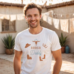 Camiseta Pai Rodeo WYNONA Orange & Teal Cowgirl<br><div class="desc">Esta camisa apresenta gráficos cor de laranja e cor de rosa e as palavras 'pai rodeio' em uma combinação de fontes de rodeio doce. Esta camisa de pai é o presente perfeito para o seu pai favorito, uma primeira camisa de festa de aniversário, ou funciona como uma ideia de anúncio...</div>