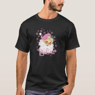 Camiseta Papais noeis cor-de-rosa acreditam em floco de nev