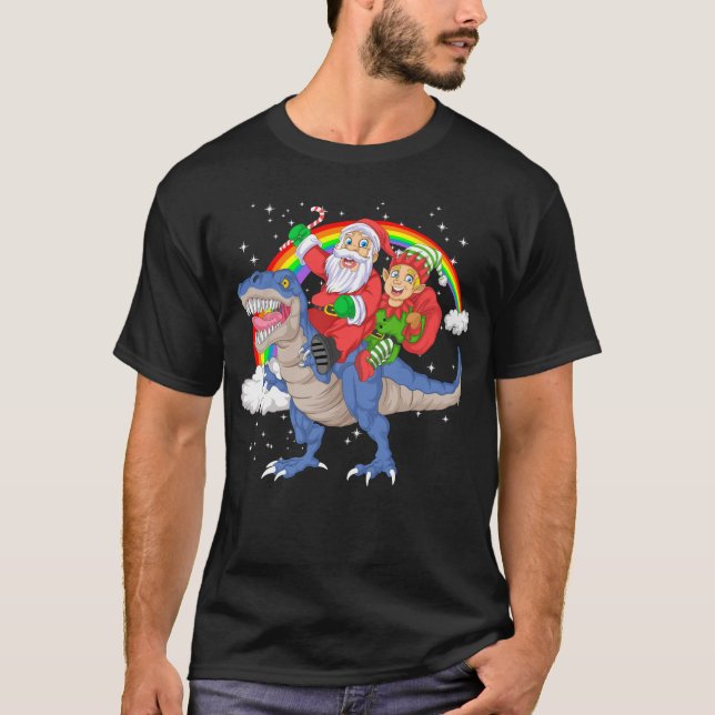 Camiseta papais noeis e elf dirigindo dinossauro trex (Frente)