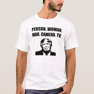 Camiseta Pessoa. Mulher. Cara. Câmera. TV. Anti-Trump