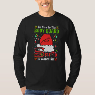 Camiseta Pijama de Natal Santa Seja Legal com o Guarda-Cost