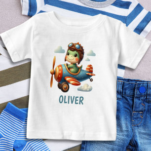 Camiseta Piloto Fofo Trex Dinossauro Voando um Avião Azul