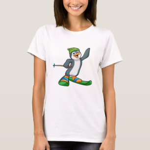 Camiseta Pinguim como esquiador com esqui e Boné
