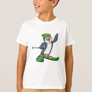 Camiseta Pinguim como esquiador com esqui e Boné