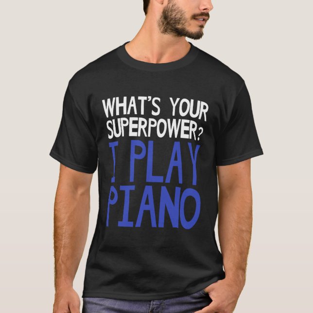 Camiseta Qual é o seu superpoder que eu toco pianista de ca (Frente)