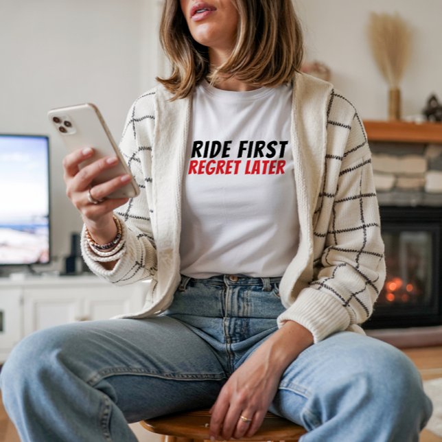 Camiseta Retro bike Girl Irony red black (Accompanying the bike graphic is a fun and playful saying: "Ride First, Regret Later.")