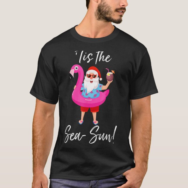 Camiseta Santa Claus Flamingo Float É o Sea Sun Christm (Frente)