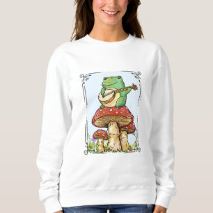 Camiseta Sapo cottagecore com casa de cogumelo tocando banj