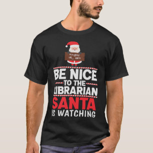 Camiseta Seja Bom para o Papai Noel da Bibliotecária Assist