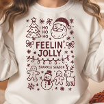 Camiseta Sentir Jolly Christmas Doodle Collage Sweatshirt<br><div class="desc">Entre no espírito de Natal com esta camisa de Natal divertida e festiva "Feelin' Jolly"! Apresentando uma encantadora colagem de rabiscos de ícones clássicos de feriado, incluindo o Papai Noel, uma rena, um homem de gengibre, um boneco de neve, e uma árvore de Natal, esta design é perfeita para qualquer...</div>