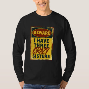 Camiseta Tenho Três Irmãs Loucas... Cuidado Com Um Advertên