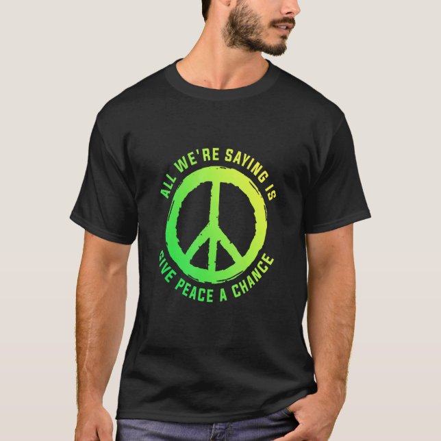 Camiseta Tudo O Que Estamos Dizendo É Dar À Paz Um Sistema  (Frente)