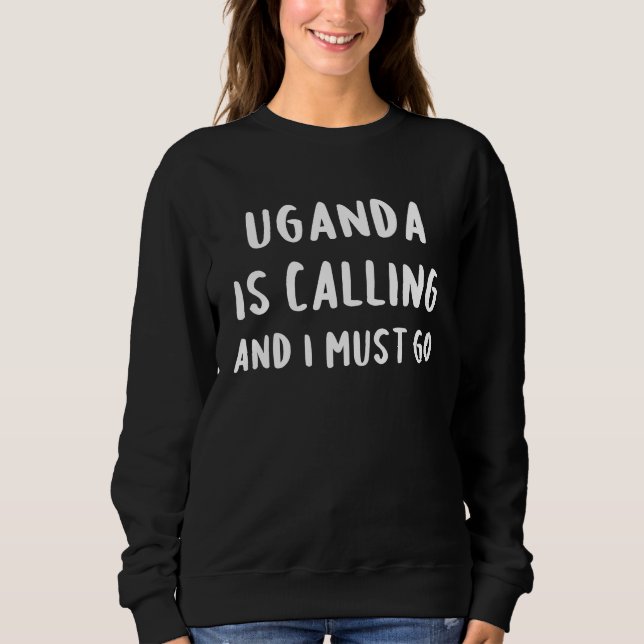 Camiseta Uganda Está Chamando E Eu Devo Ir de Férias Engraç (Frente)