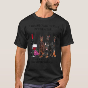 Camiseta Uma Mulher Não Pode Sobrevir Só Com Vinho Doberman