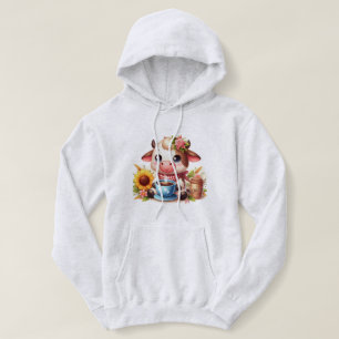 Camiseta Vaca branca segurando copa de café com girassol