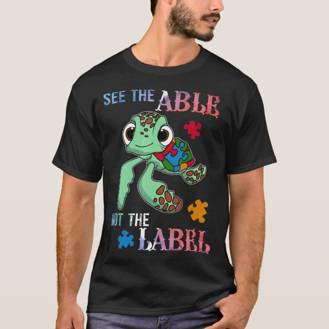 Camiseta Veja A Habilidade De Não O Rótulo Awarenes Autista (Frente)