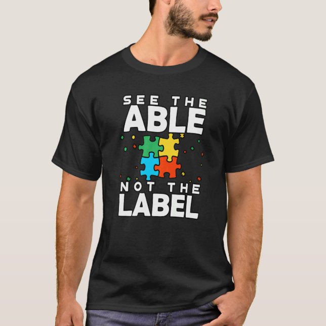Camiseta Veja O Able Not The Label Quebra-cabeça Autism Con (Frente)