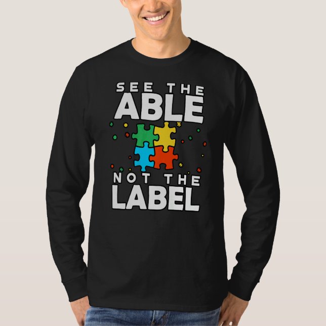 Camiseta Veja O Able Not The Label Quebra-cabeça Autism Con (Frente)