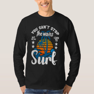 Camiseta Você Não Pode Parar as Ondas Mas Pode Aprender a S