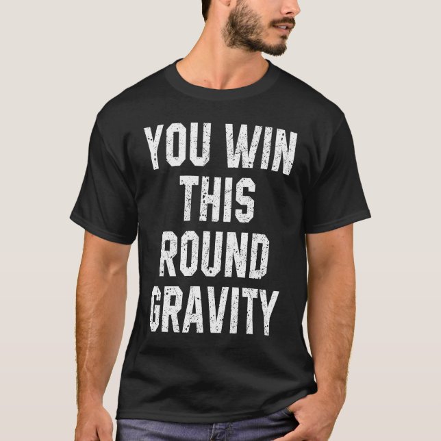 Camiseta Você Vence Esta Rodada Gravidade Braço Quebrado Re (Frente)