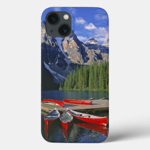 Canada, Alberta, Moraine Lake. Red canoes await