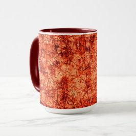 Caneca Arranhões num fundo coral ligeiramente visto