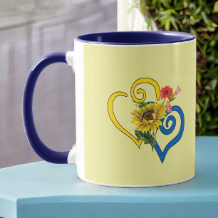 Caneca Coração Torcido Amarelo Azul com Girassol em Ama