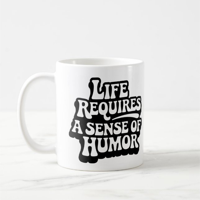 Caneca De Café "A Vida Requer Um Senso De Humor" (Esquerda)