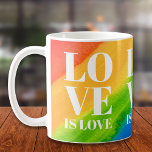 Caneca De Café Amor É Orgulho Arco-Íris<br><div class="desc">Esta Orgulho gay Mug é decorada com LOVE IS LOVE em tipografia branca em negrito sobre um fundo arco-íris de cor d'água de vermelho,  laranja,  amarelo,  verde,  azul e roxo. Original Watercolor © Michele Davies.</div>