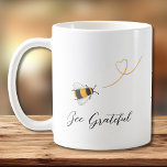 Caneca De Café Bee Grateful<br><div class="desc">Esta caneca de café é decorada com abelhas melíferas e "Bee Grateful" na tipografia de na moda. Facilmente personalizável com seu monograma. Original Watercolor © Michele Davies.</div>