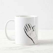 black and white hand on coffee mug