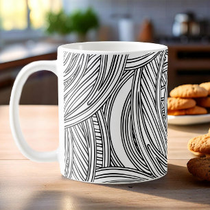 Caneca de café branca e preta moderna com espirais